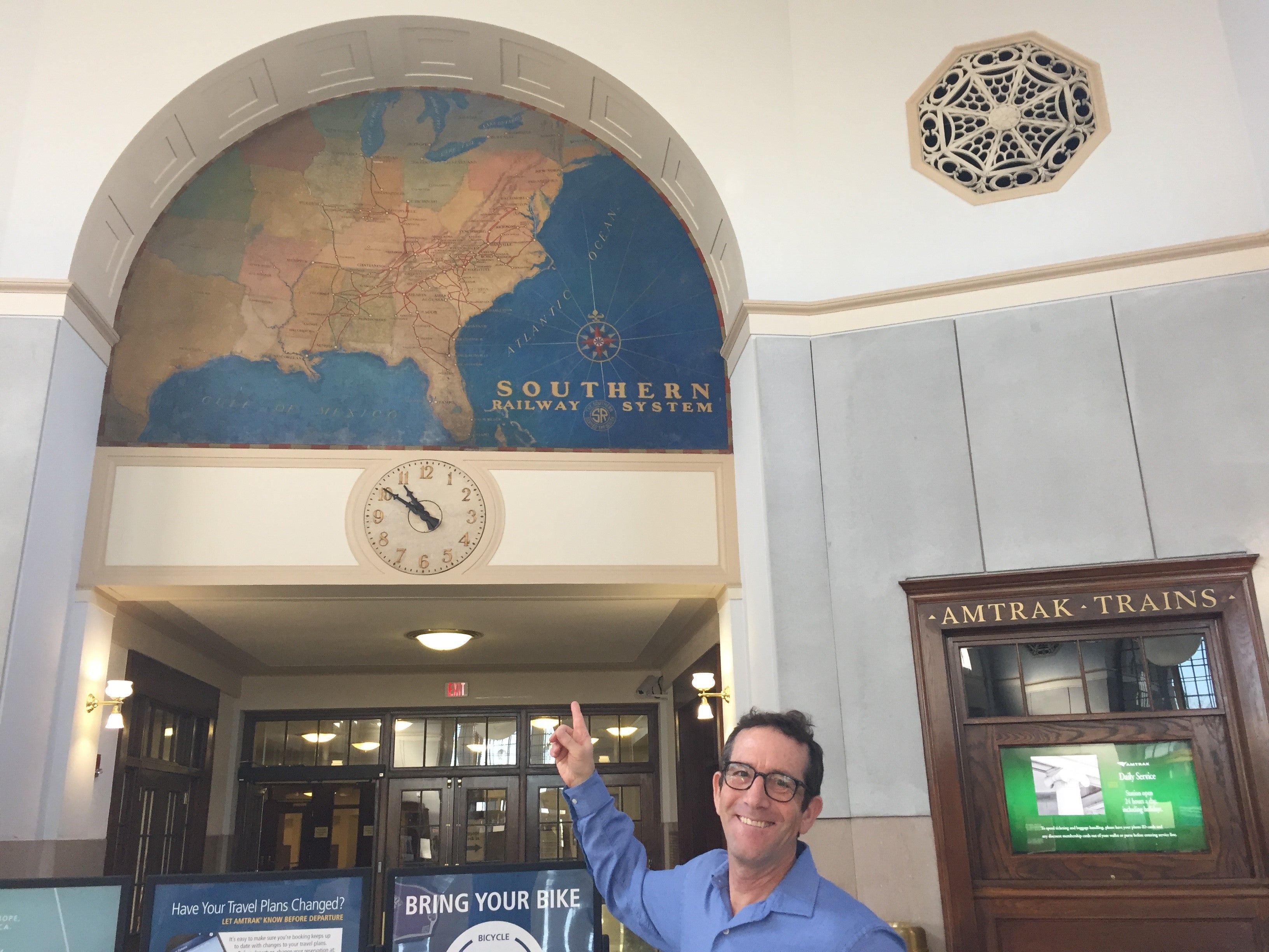 Mike at historic Greensboro NC Amtrak station with cool US map on wall