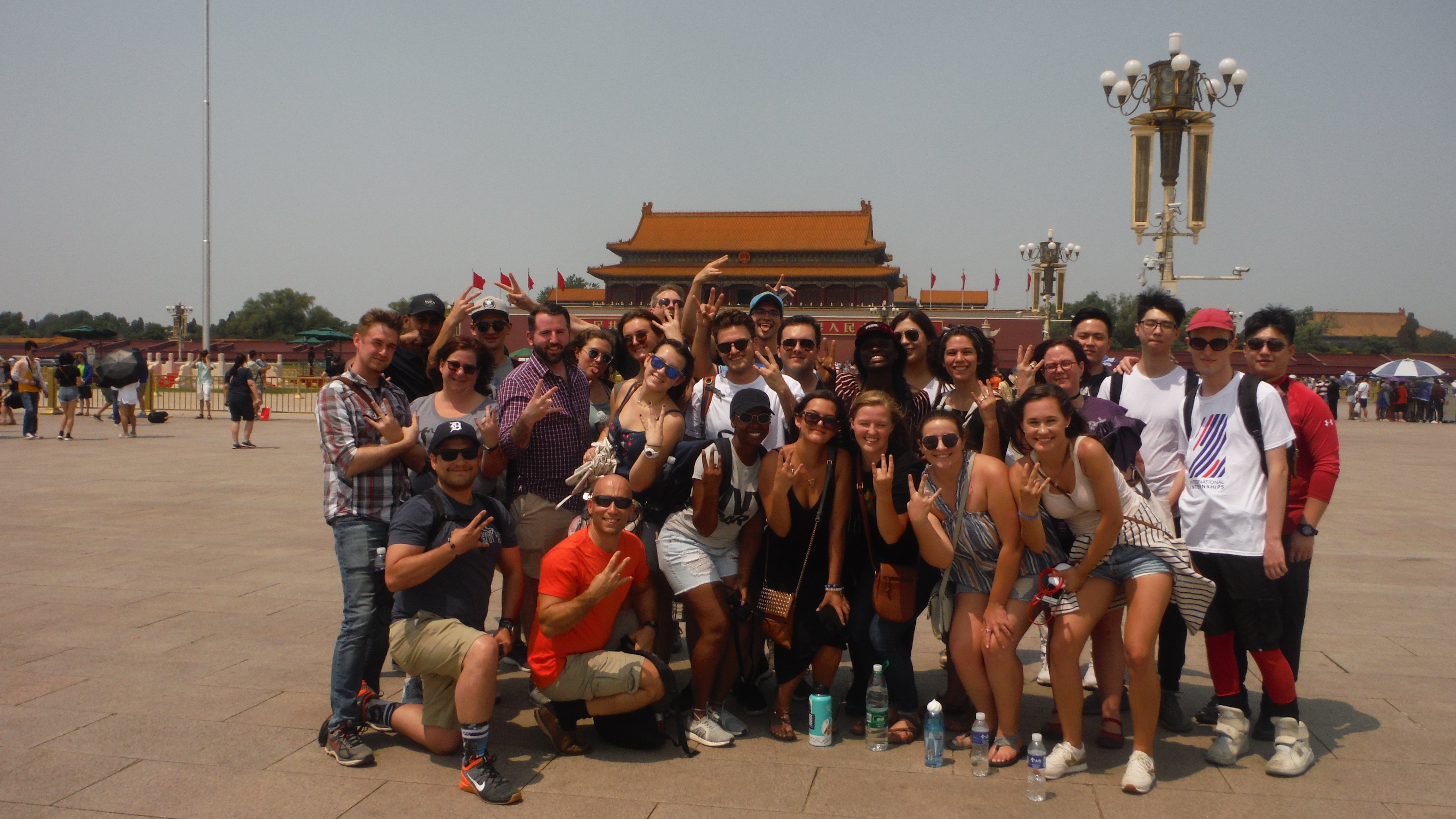 Students stand in front of Forbidden City in Tienanman Square