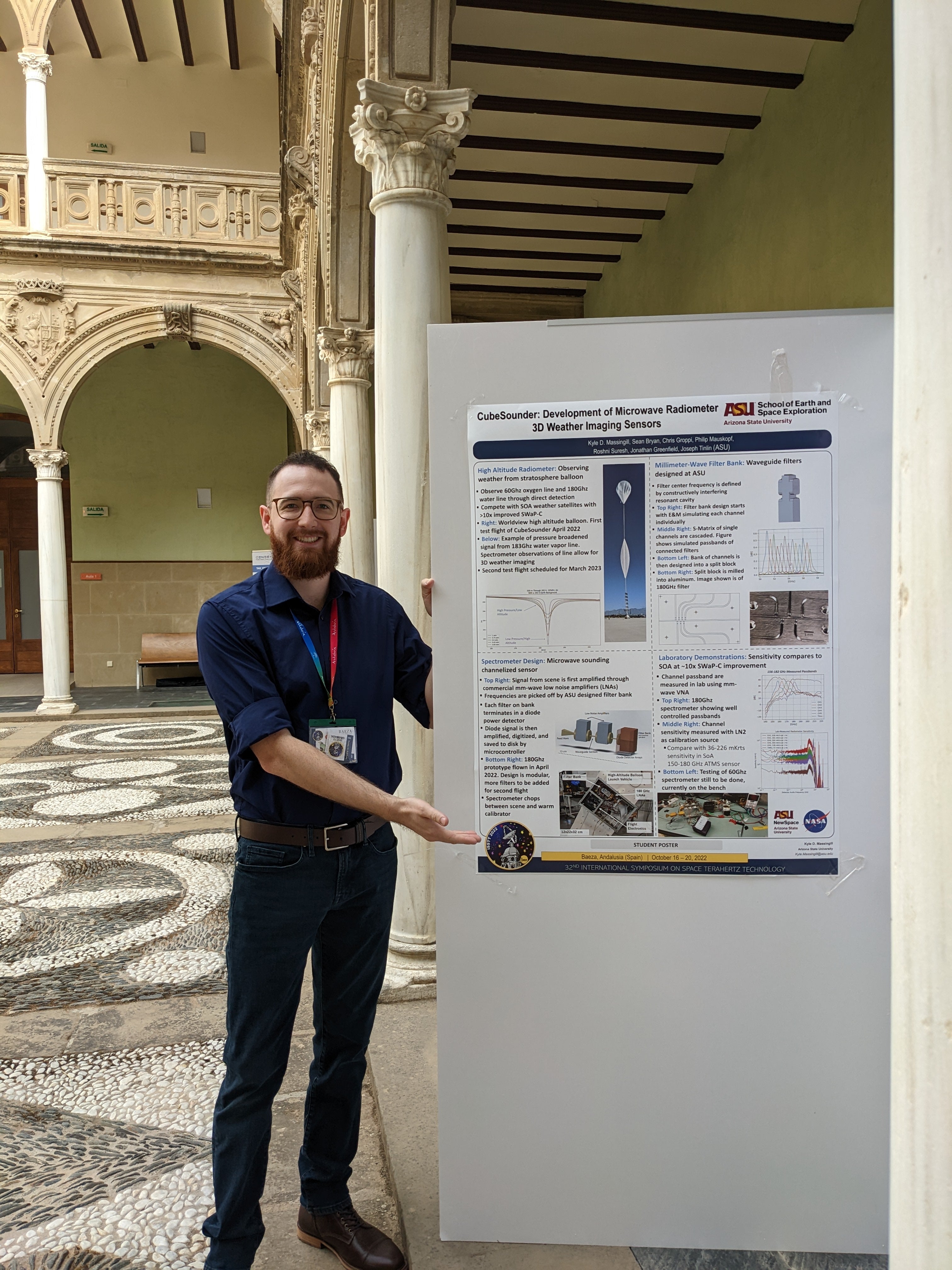 Kyle with a poster in Spain