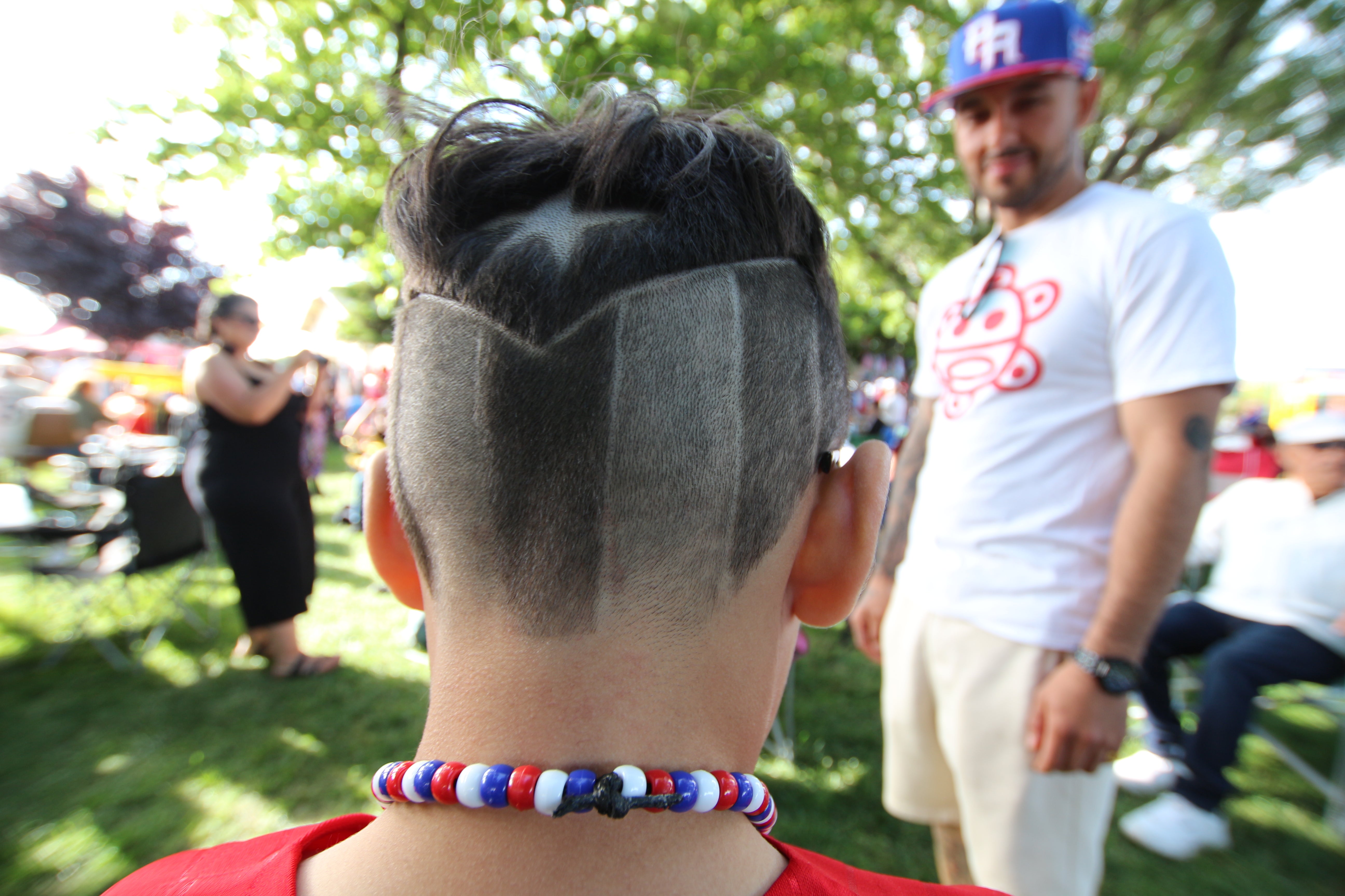 Puerto Rican flag buzzed into the hair of a young boy