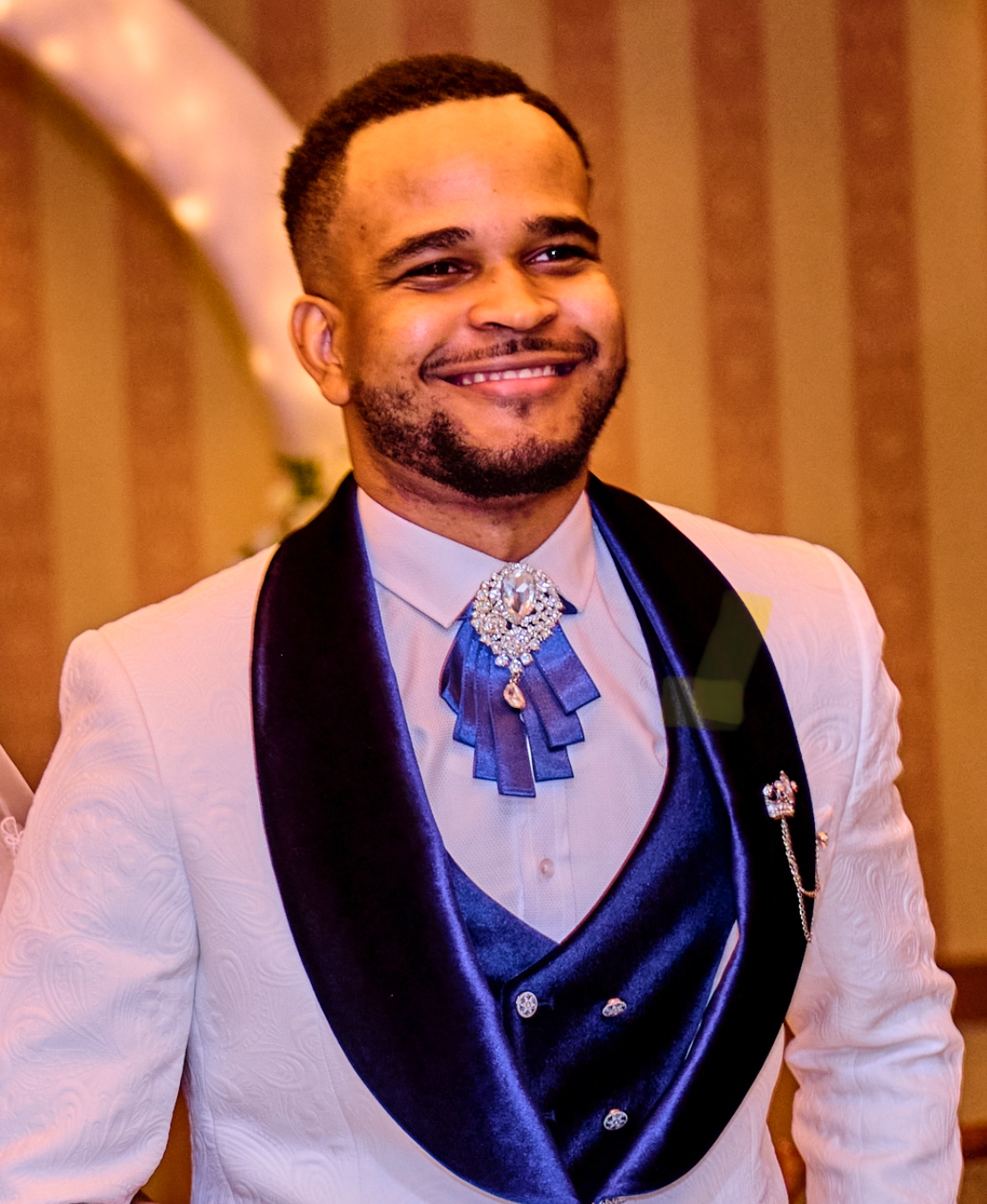 A portrait of Clauny Cassagnol, a professional leader and entrepreneur, smiling. He has a warm expression.