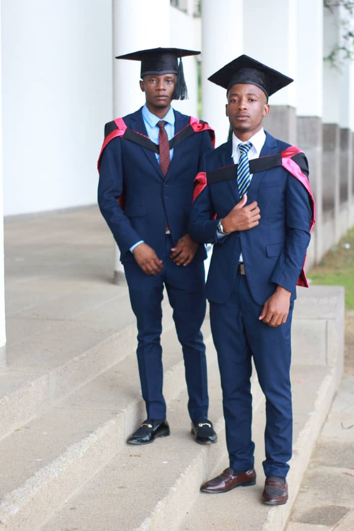 Mcebisi Moyo and a fellow graduate at November 2022 graduation ceremony.